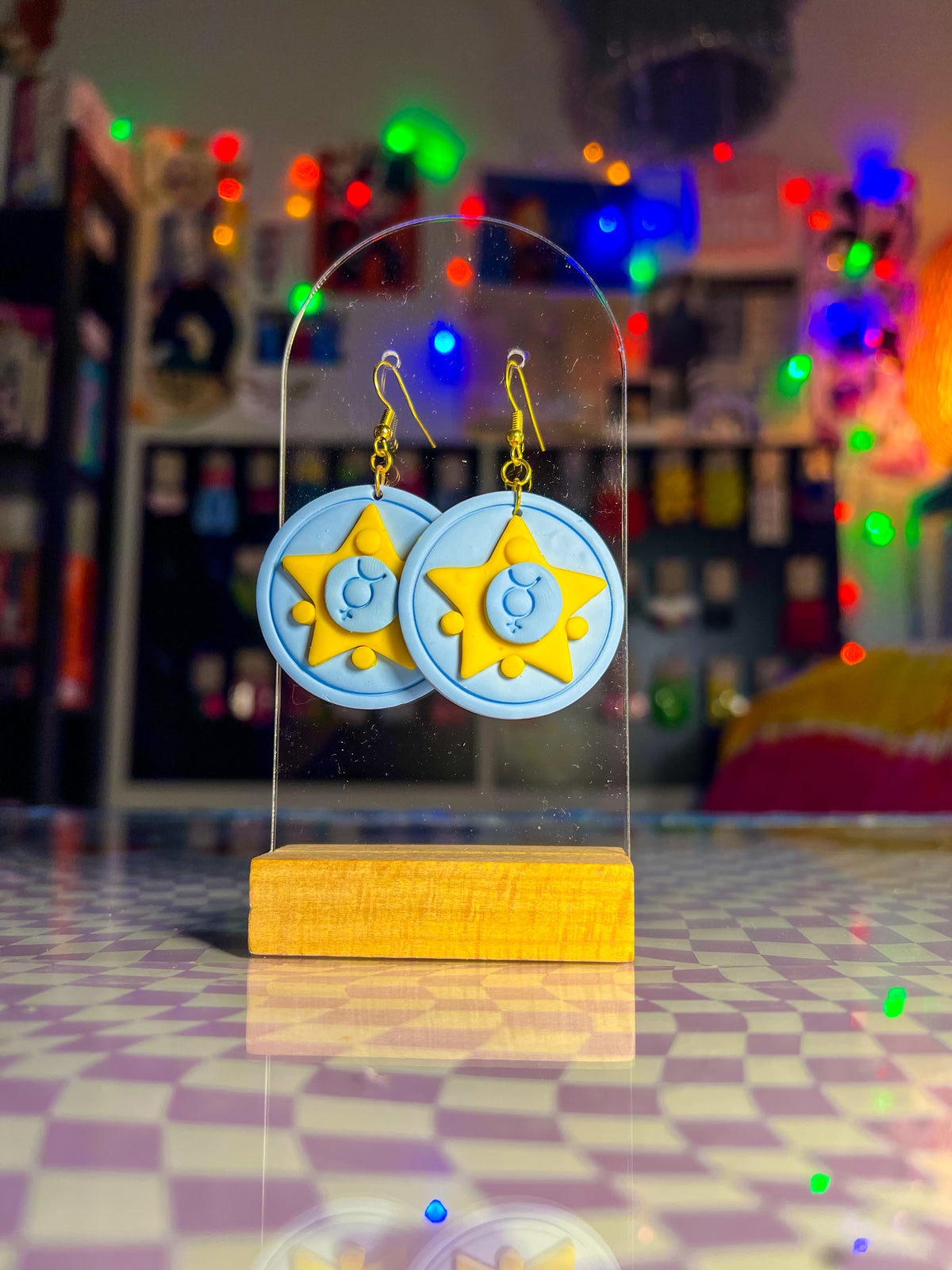 Magical girl statement earrings with cool-toned celestial details