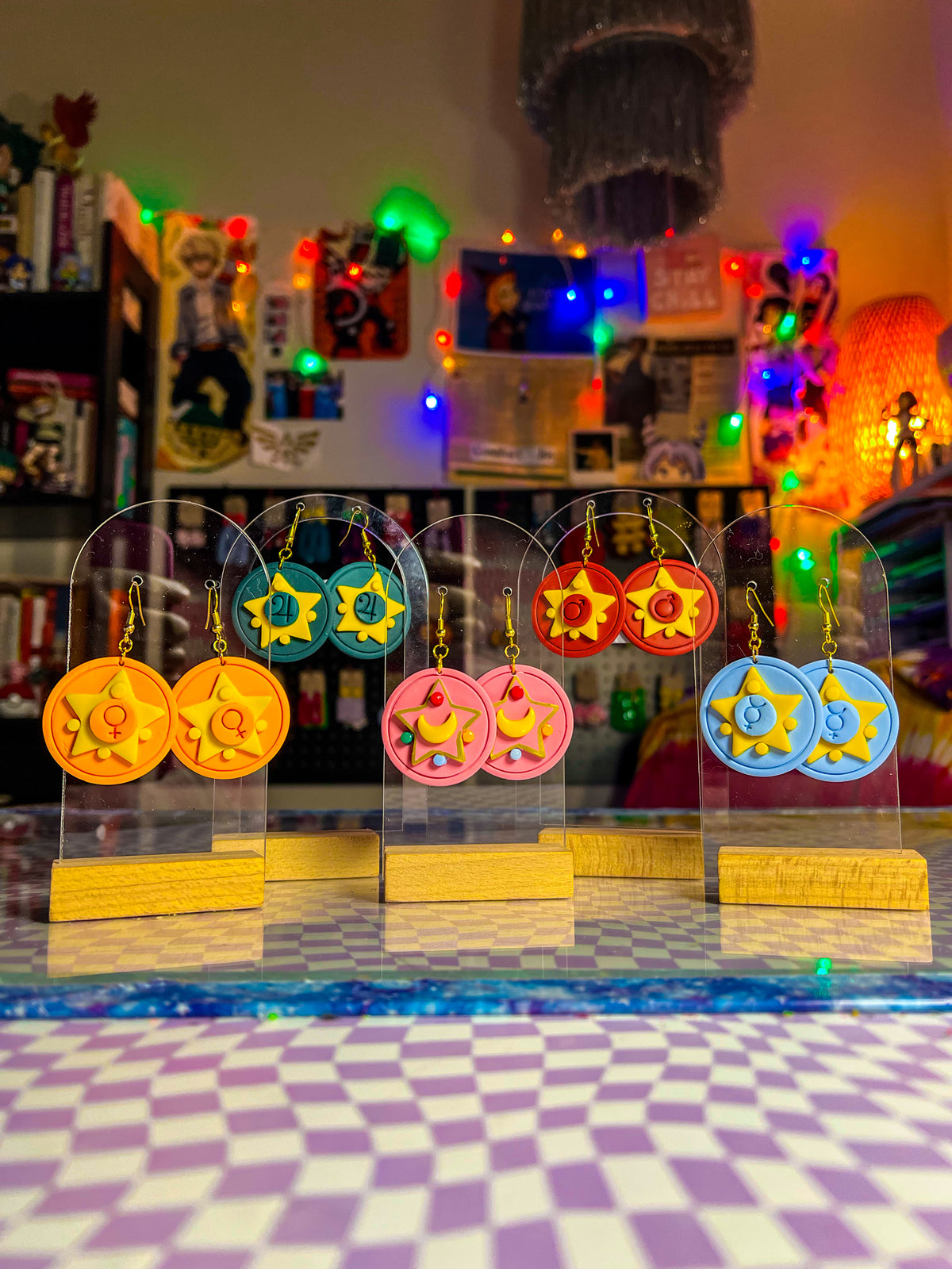 Handmade anime-inspired earring collection with moon and planet details
